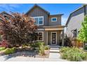 Charming two-story home features modern architecture, landscaped yard, and inviting front porch at 6771 Canosa St, Denver, CO 80221