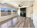 Bright living room showcasing a fireplace and large windows at 5470 Danube St, Denver, CO 80249