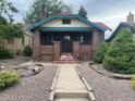 Quaint brick home with a well-maintained front yard and inviting walkway at 1881 S Lincoln St, Denver, CO 80210