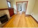 Bright living room with hardwood floors and a charming fireplace at 1881 S Lincoln St, Denver, CO 80210