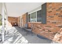 Inviting covered front porch with seating area, perfect for relaxing and enjoying the outdoors at 1040 Hemlock Way, Broomfield, CO 80020