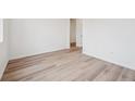 A bright, airy bedroom with beautiful hardwood floors, perfect for creating a relaxing retreat at 24747 E 40Th Ave, Aurora, CO 80019