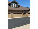 Exterior of a townhome showing a two-car garage with visible house number at 12317 W Gould Ave, Littleton, CO 80127