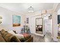 Open living area showcasing neutral paint, modern lighting, and views into the home's layout at 1024 E 14Th Ave # 9, Denver, CO 80218