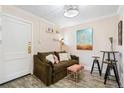 Cozy living room features modern lighting, neutral wall tones, and plush seating for comfortable living at 1024 E 14Th Ave # 9, Denver, CO 80218