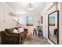 Inviting living room with modern lighting and light walls, a cozy couch, and stylish accents at 1024 E 14Th Ave # 9, Denver, CO 80218