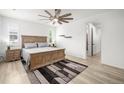 Relaxing main bedroom featuring a ceiling fan, a queen bed and lots of natural light at 9157 Rio Lado St, Littleton, CO 80125