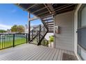Balcony featuring sturdy railing and ample space for outdoor relaxation and views of the green common area at 8100 W Quincy Ave # A8, Littleton, CO 80123