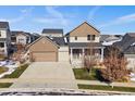 Charming two-story home with a well-manicured front yard and inviting covered porch at 4565 Colorado River Dr, Firestone, CO 80504