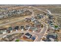 An aerial view highlights the layout of a suburban neighborhood, showcasing the road layout and house placement at 4807 River Highlands Loop, Elizabeth, CO 80107