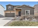 Charming two-story home with a well-manicured front yard, attached garage, and neutral color palette at 4807 River Highlands Loop, Elizabeth, CO 80107