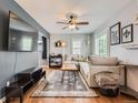 Bright living room with hardwood floors, neutral paint, and lots of natural light at 4747 S Elati St, Englewood, CO 80110
