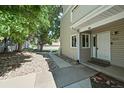 Charming townhome exterior showcasing well-maintained landscaping and a welcoming entryway at 2678 S Xanadu Way # C, Aurora, CO 80014