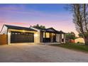 Ranch home featuring a spacious driveway and a convenient two-car garage at 6369 W 69Th Ave, Arvada, CO 80003