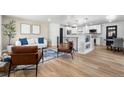 Open-concept living area with modern decor and seamless flow to the kitchen at 6369 W 69Th Ave, Arvada, CO 80003