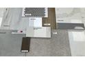 Selection of modern home materials, featuring cabinet color, carpet, LVP floors, tile walls and accents, and matching countertops at 24207 E 53Rd Dr, Aurora, CO 80019