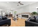 Spacious living room featuring a modern fireplace, hardwood floors, and natural light at 4059 Quivas St, Denver, CO 80211