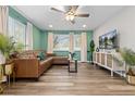 Inviting living room with hardwood floors, ample light, and comfortable seating at 8506 Eaton St, Arvada, CO 80003