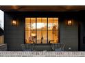 Inviting front porch with seating area and large window offering a glimpse of the interior at 1680 S Humboldt St, Denver, CO 80210
