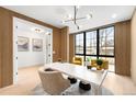 Spacious home office featuring wood paneling, and modern light fixture at 1823 W 35Th Ave, Denver, CO 80211