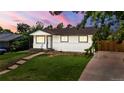 Inviting single-story home showcasing a walkway and a well-maintained front yard at 871 S Worchester St, Aurora, CO 80012