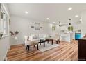 Bright and airy living room features hardwood floors, modern decor and an open floor plan at 871 S Worchester St, Aurora, CO 80012