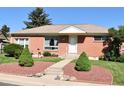 Charming brick home featuring manicured landscaping and a welcoming front entrance at 10759 Ogden St, Northglenn, CO 80233