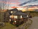 Beautiful mountain home with a spacious deck, perfect for enjoying the surrounding natural beauty at sunset at 10 River Park Dr # A, Breckenridge, CO 80424