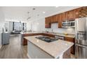 Modern kitchen with stainless steel appliances and granite countertops at 12844 King St, Broomfield, CO 80020