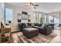 Cozy living room showcases a large sectional sofa, patterned rug, and modern decor at 7203 W Pacific Ave, Lakewood, CO 80227
