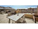 Outdoor patio area with a rustic table, seating, and decor, perfect for outdoor dining and relaxation at 1950 N Logan St # 411, Denver, CO 80203