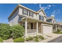 Charming two-story home featuring a welcoming front porch and well-maintained lawn at 4545 S Monaco St, Denver, CO 80237