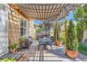 Relaxing patio with pergola, seating, and hot tub at 9206 Hickory Cir, Highlands Ranch, CO 80126