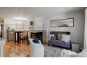 Cozy living room features a fireplace and built-in shelving at 1885 S Quebec Way # H15, Denver, CO 80231