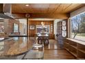 Spacious kitchen with a view into the dining room, showcasing hardwood floors and ample natural light at 1400 E Bates Ave, Englewood, CO 80113