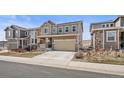 Charming two-story home with a manicured lawn and an attached two-car garage at 2464 Garganey Dr, Castle Rock, CO 80104