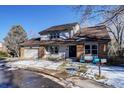 Two-story home with brick and siding, attached garage, and landscaping at 3080 E Geddes Pl, Centennial, CO 80122