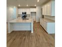 Spacious kitchen with a large island, stainless appliances, and lots of counter space at 9041 Redfield Ln, Parker, CO 80134