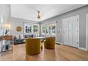Inviting living room featuring hardwood floors, large windows, and modern decor at 3820 S Grant St, Englewood, CO 80113