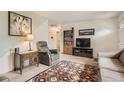 Inviting living room with cozy seating, patterned rug, and natural light at 3751 W 85Th Ave, Westminster, CO 80031