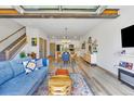 Bright and open living room featuring modern decor and seamless indoor-outdoor flow at 4021 S Teller St, Lakewood, CO 80235