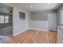 Open dining area with hardwood floors and neutral paint, offering versatile space at 5925 W 86Th Ave, Arvada, CO 80003