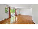 Living room with hardwood floors and sliding glass doors to balcony at 1073 Xenon St, Golden, CO 80401