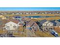 Beautiful neighborhood aerial view, showcasing the landscape and nearby pond at 1392 S Duquesne Cir, Aurora, CO 80018