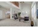Spacious living area with a fireplace and kitchen view at 9877 Grove St # C, Westminster, CO 80031