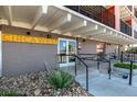The Circa West building entrance features accessible ramps, signage, and a secure entry for residents and visitors at 1495 Vrain St # 110, Denver, CO 80204