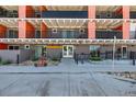 Modern building exterior with a clean and inviting entrance and a variety of colorful architectural elements at 1495 Vrain St # 110, Denver, CO 80204