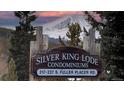 Silver King Lode Condominiums sign with a scenic view of snow-capped mountain in the background at 223 S Fuller Placer Rd # 4, Breckenridge, CO 80424
