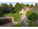 Expansive backyard featuring a well-maintained lawn and attractive landscaping at 6524 Surry Pl, Parker, CO 80134