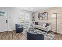 Bright living room featuring modern furniture, large windows, and hardwood floors that create a cozy atmosphere at 4512 S Yank St, Morrison, CO 80465